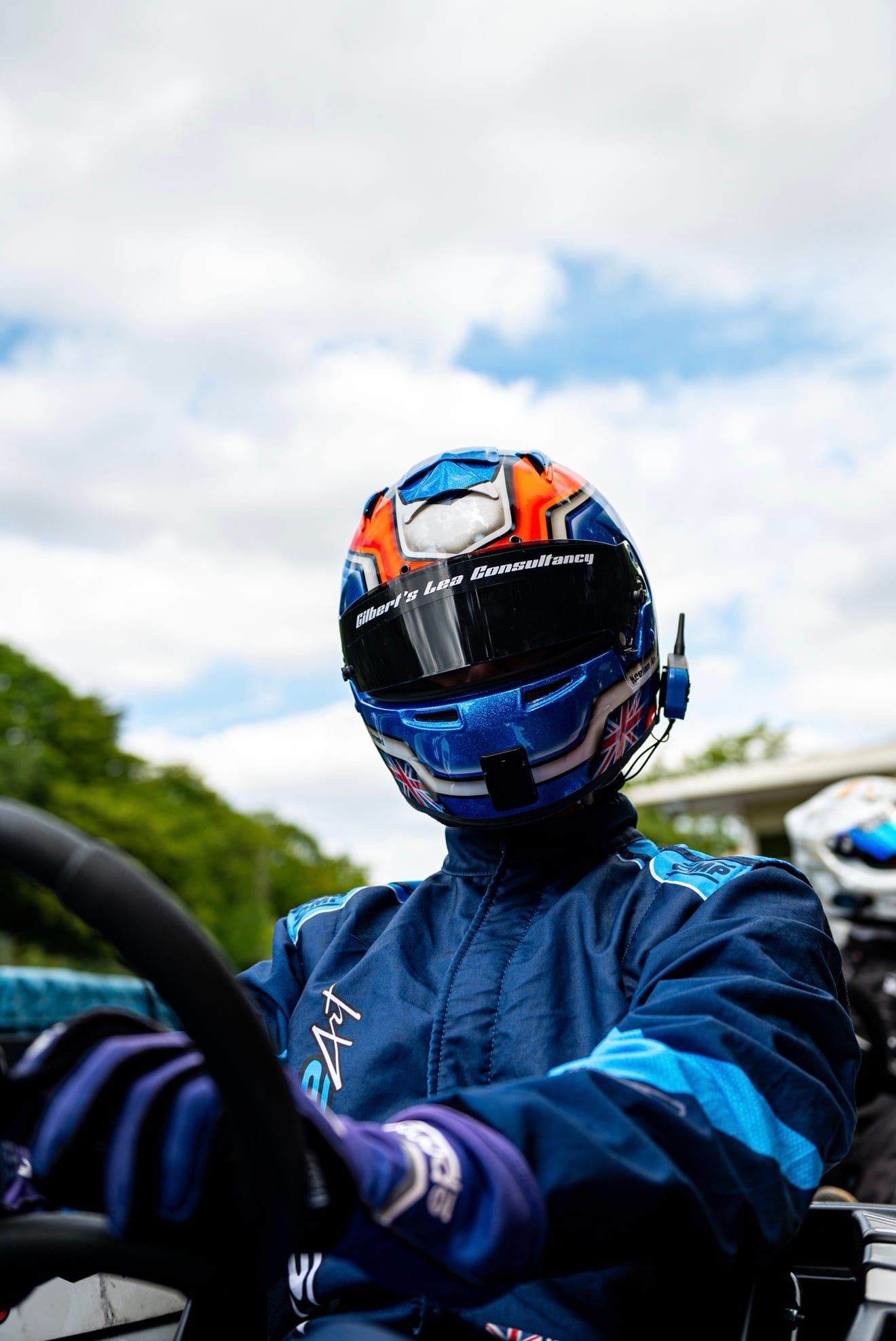 Close-up of Keelan in his orange and blue helmet