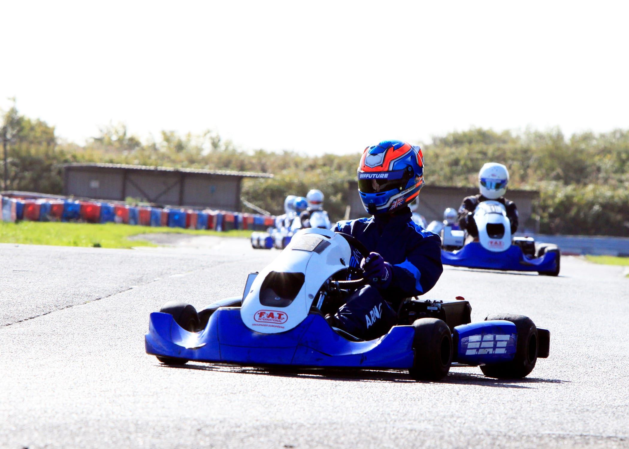 Keelan leading a pack of karts through a corner